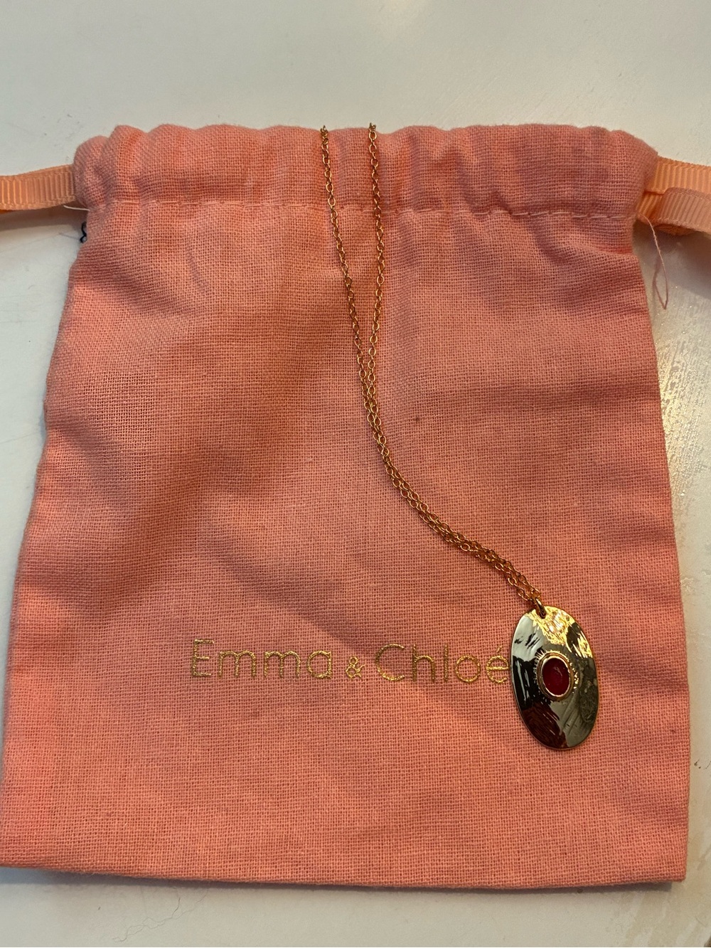Emma & Chloe Gold Tone Oval Pendant Necklace with Red Garnet Stone